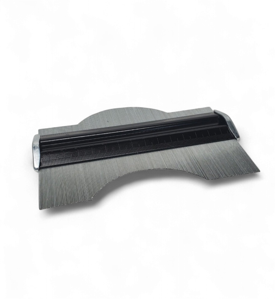 Steel profile gauge with adjustable stainless steel pins and engraved metric and imperial measurement scale, demonstrating how it conforms to an irregular contour for precise pattern tracing.
