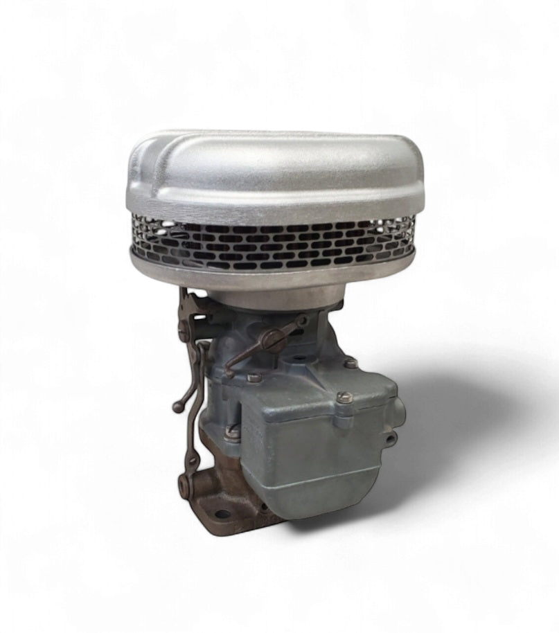 Stromberg 97 air cleaner left-side view showing finned cast-aluminum housing and carburetor base