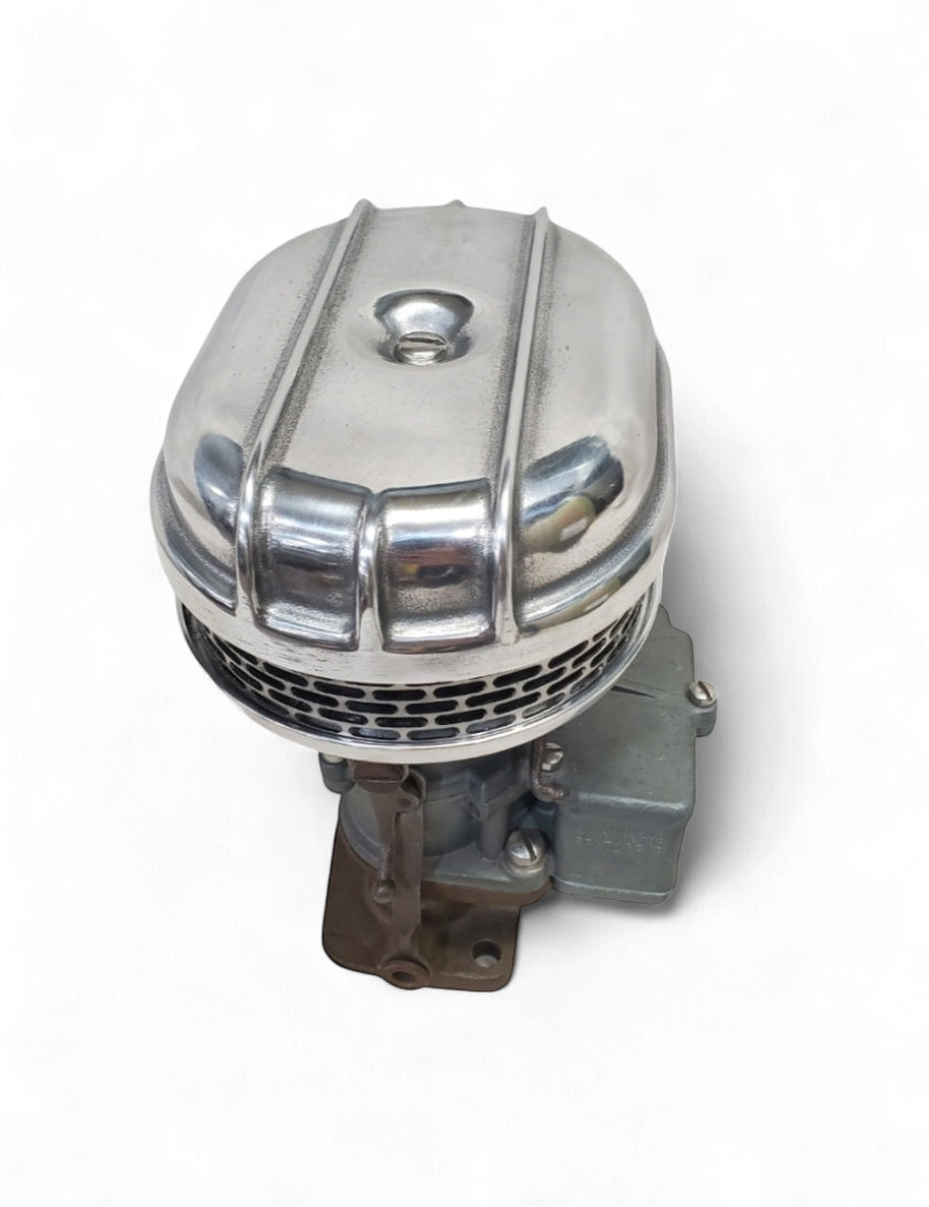 Stromberg 97 air cleaner top view showing polished finned lid and carburetor base