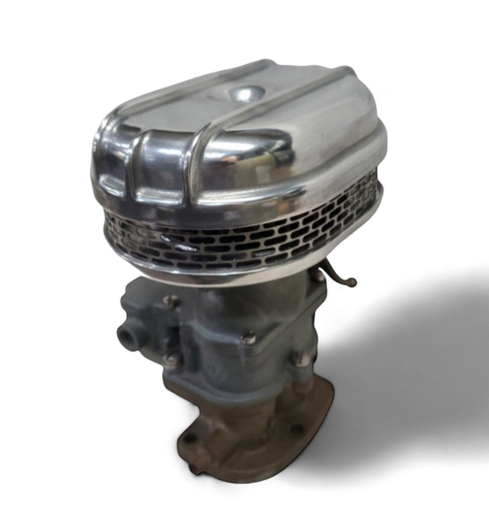 Stromberg 97 air cleaner front view showing polished finned cast-aluminum housing and washable filter