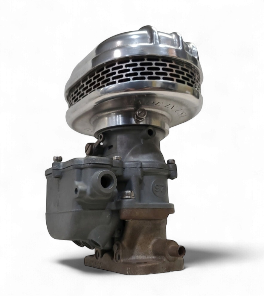 Stromberg 97 air cleaner side view showing finned cast-aluminum housing and carburetor base