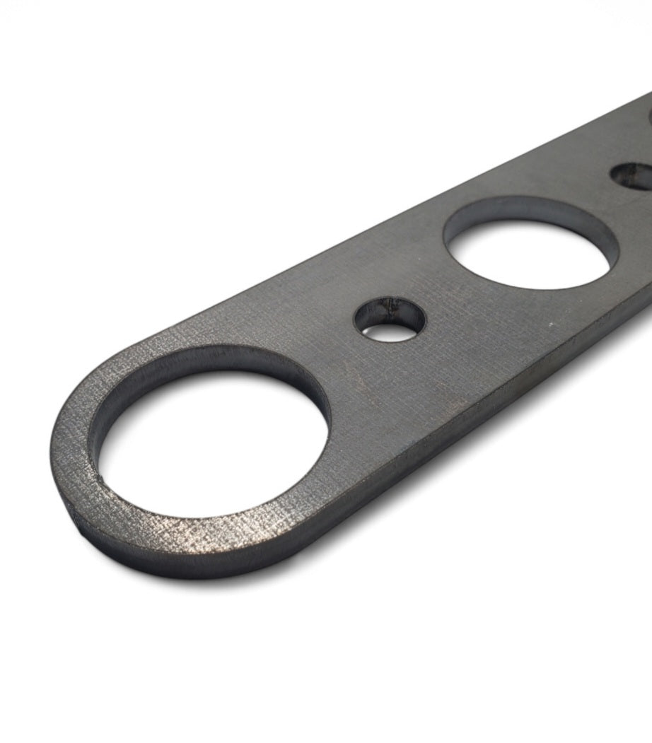 Close-up of Model A header flange showing round ports and steel finish